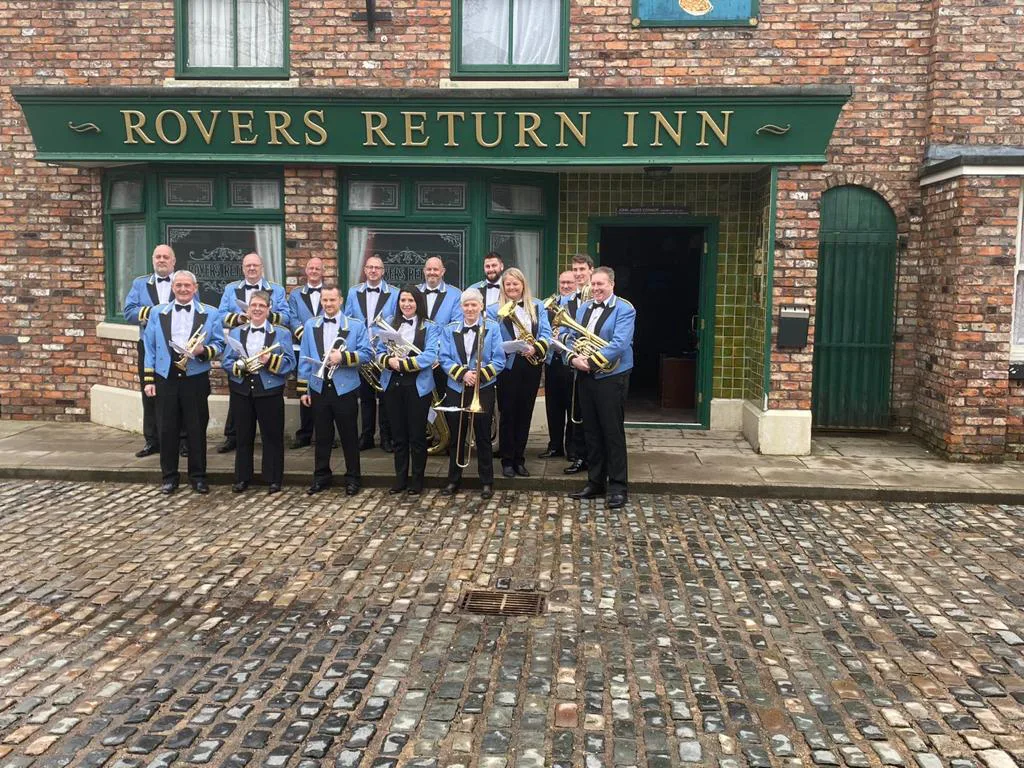 The Fairey Band performing on the Coronation Street set