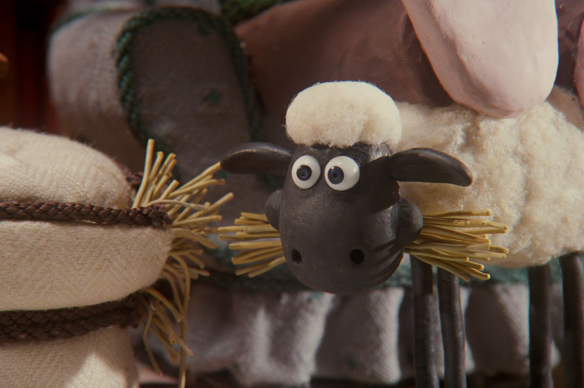 Shaun the sheep nibbling a mouthful of straw in A Close Shave